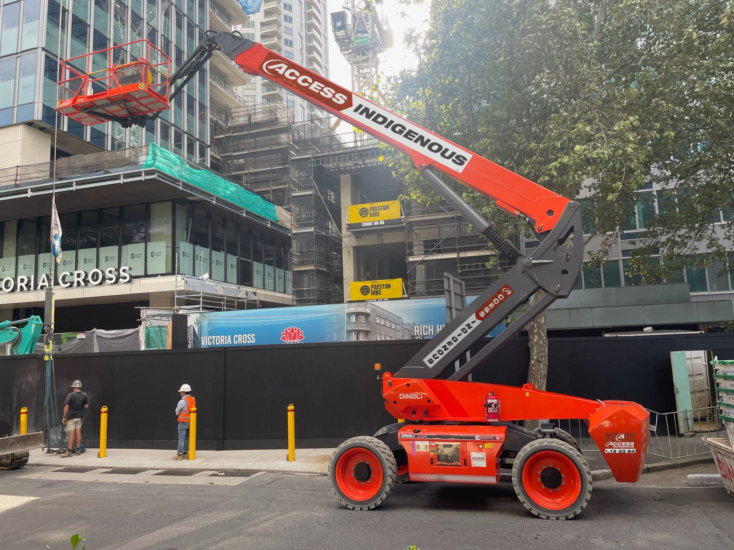 Access Indigenous telescopic boom lift operating at urban site