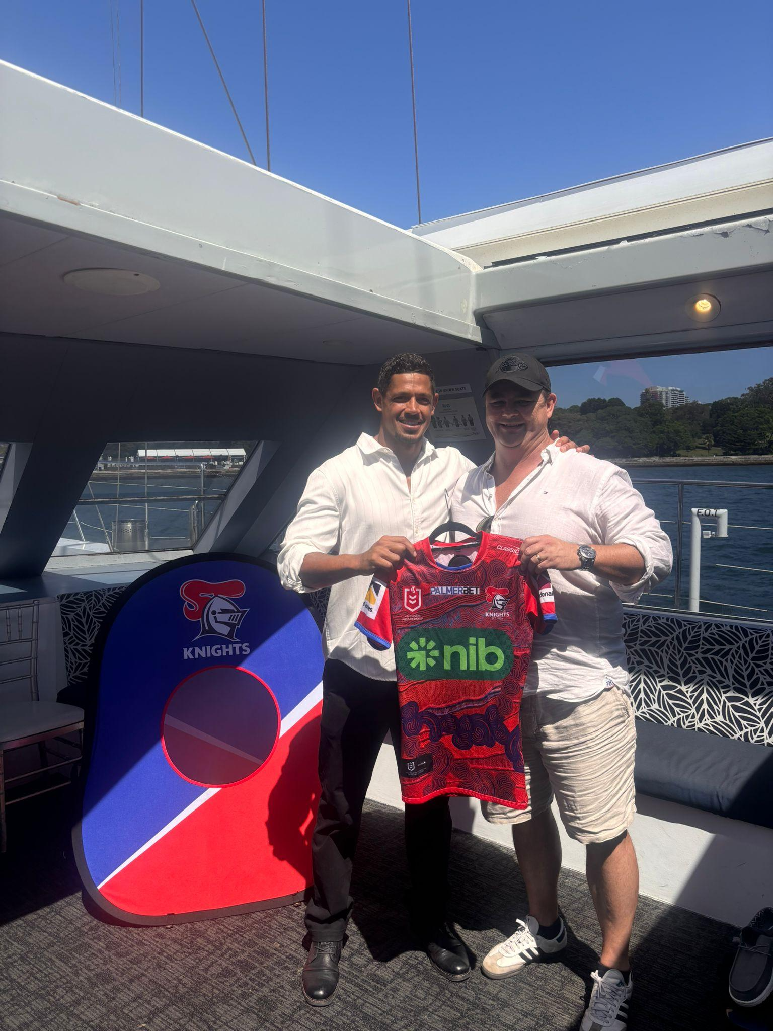 Access Hire partnership with sports team presenting branded rugby jersey